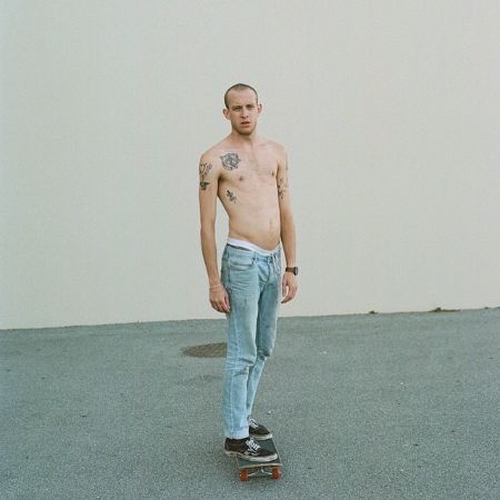 Daniel Pitout posed for a picture on a skateboard.
